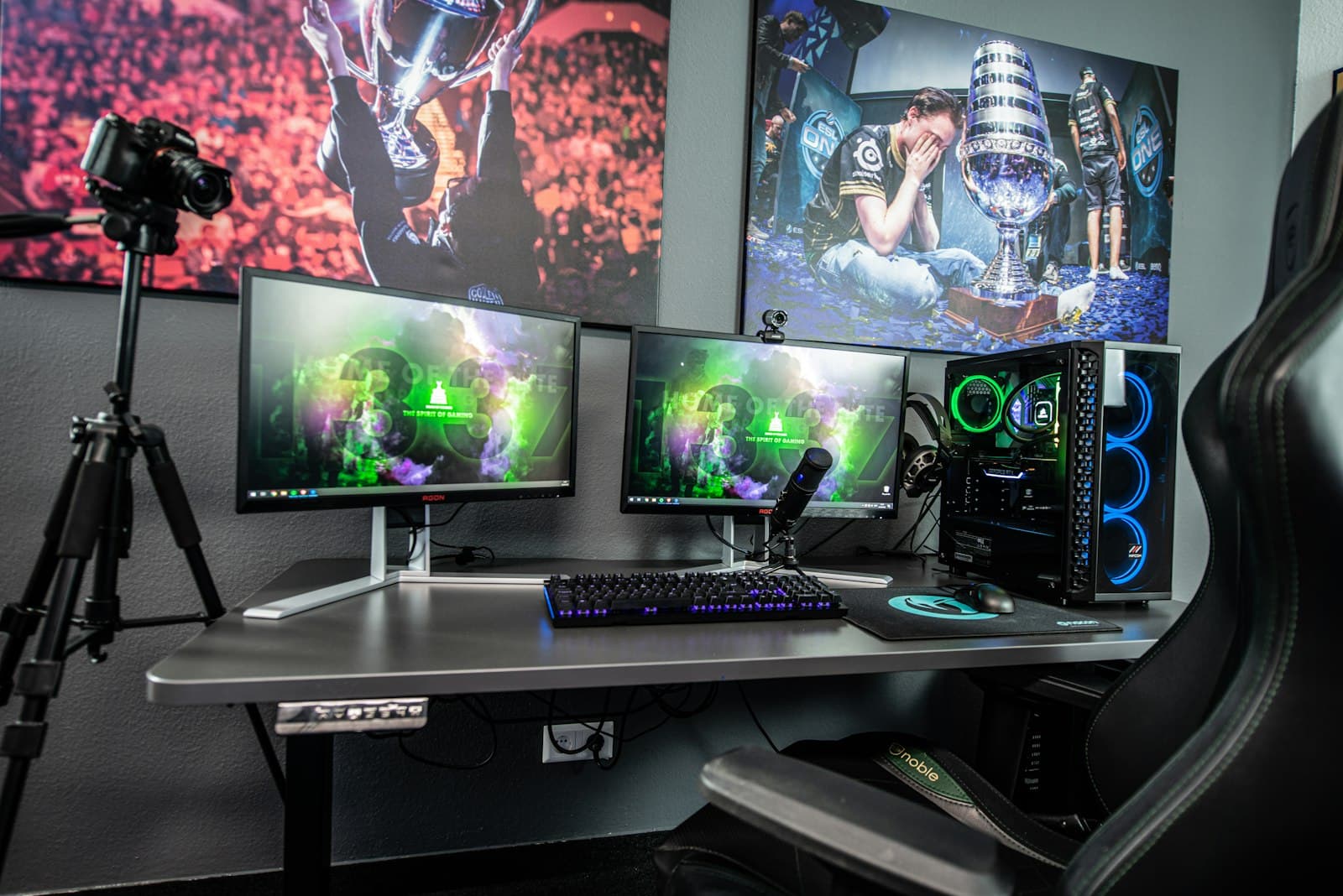 A creator's recording setup with camera, microphone, and monitors