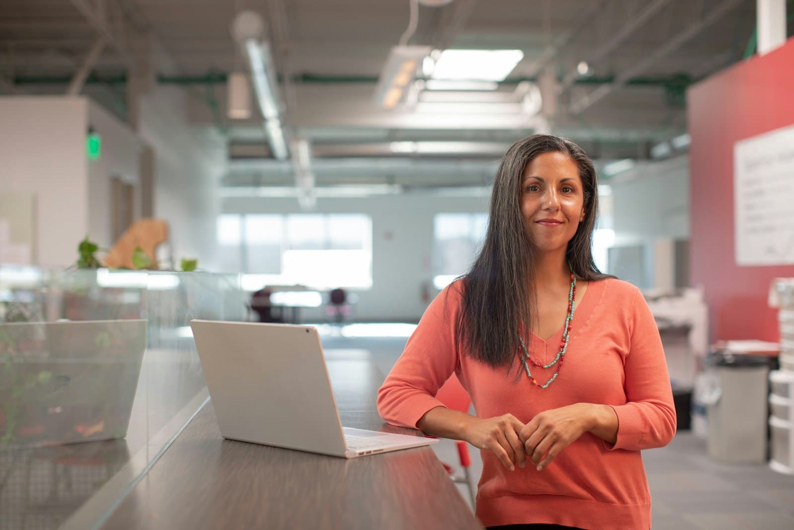 Talent manager working with creators from her desk
